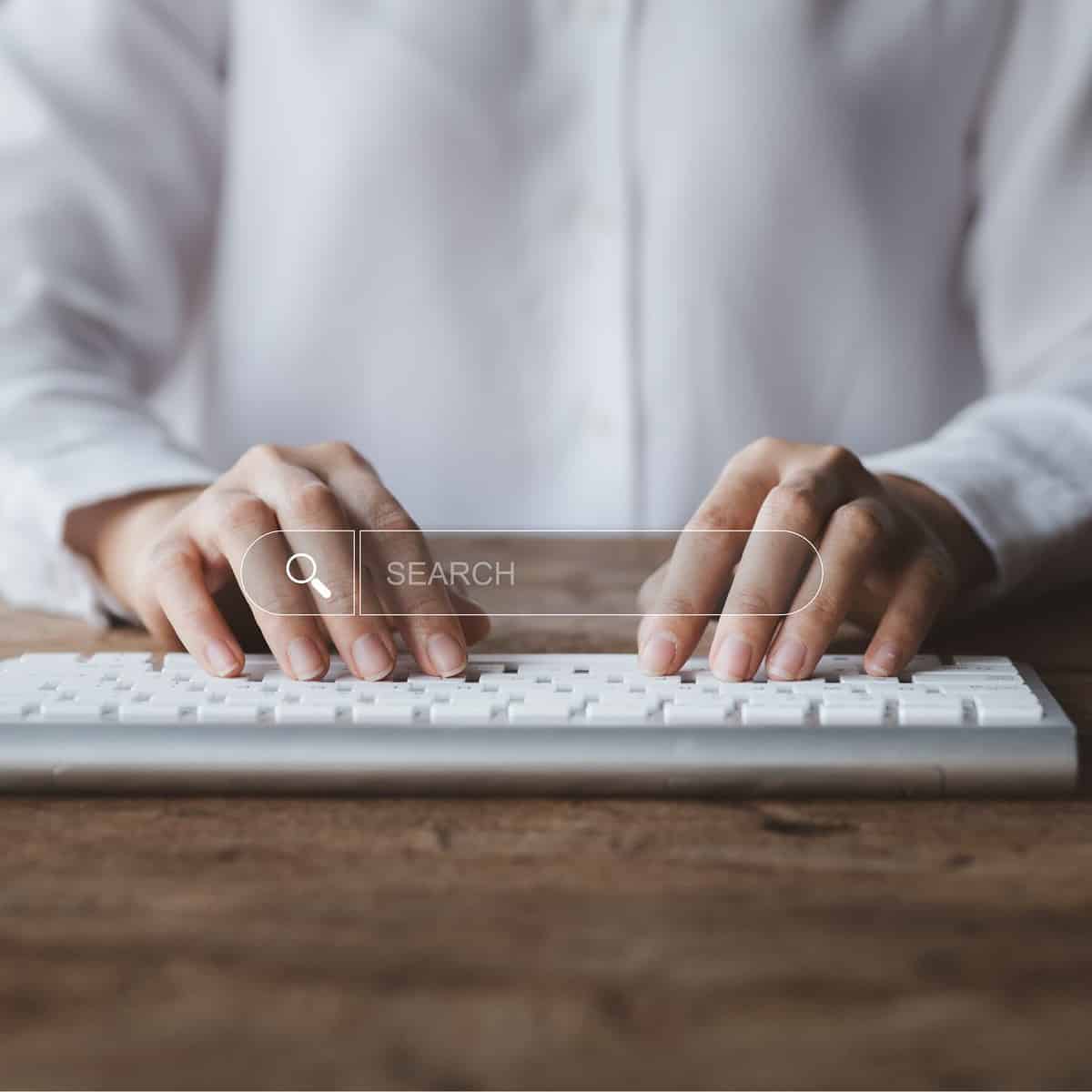 An image of a man typing in search on this How to Rank a Website on Search Engines An Easy to Understand Step-by-Step Guide