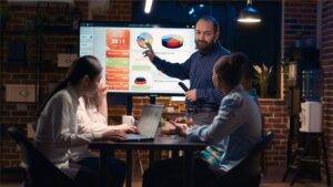 A picture of an employee analyzing data in this What is data-driven approach in digital marketing article.