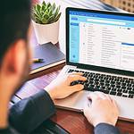 An image of a business looking at an email list in this article titled What Is Email Marketing