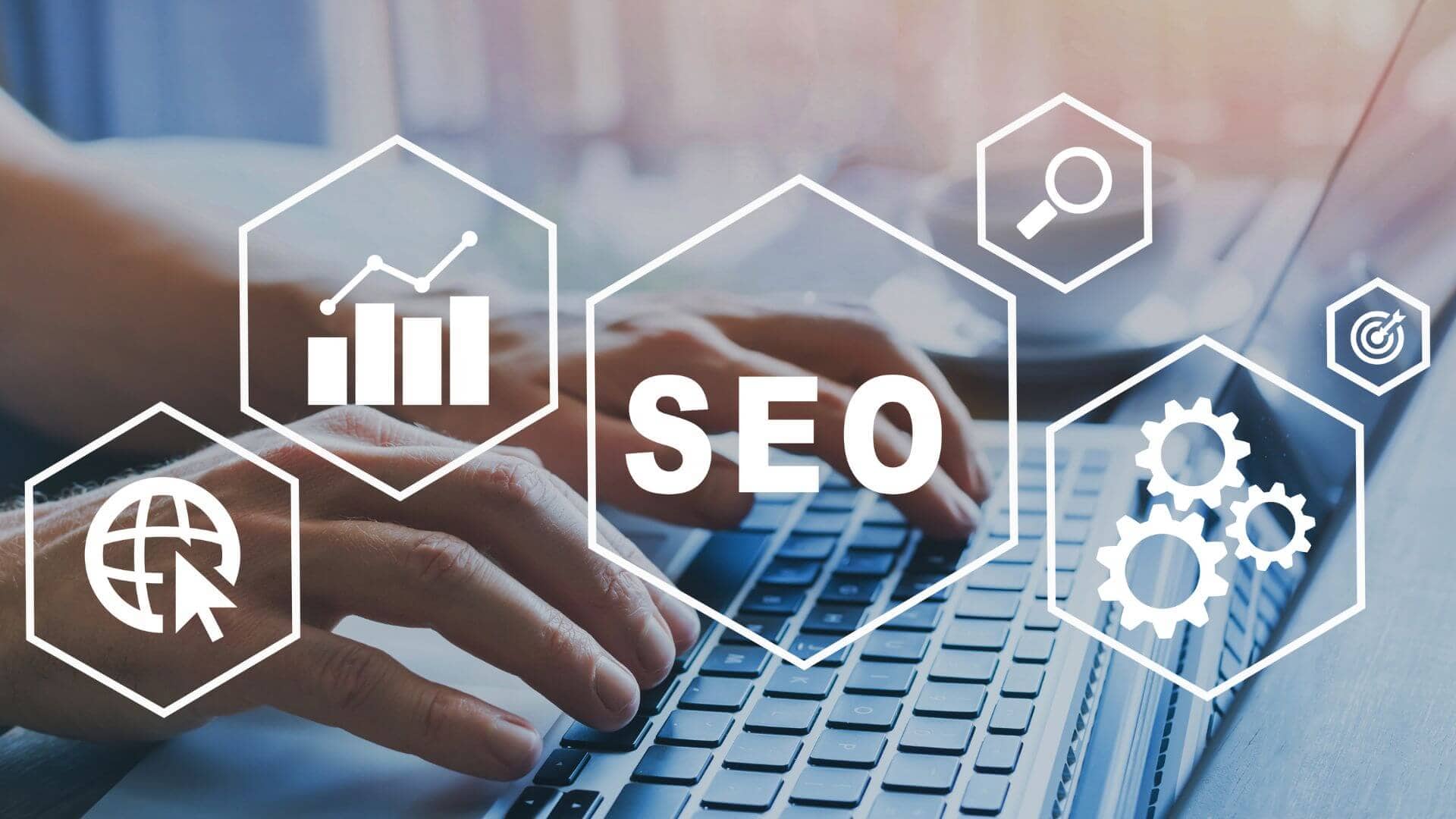 An image showing SEO concept with a human hand on a keyboard doing SEO audit of a website